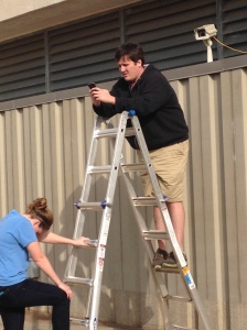 Andrew Kirkpatrick and Kat Cobb mounting the East camera and adjusting the angle